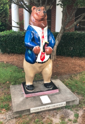 Several bear statues, like this one in front of an accounting office, are painted in various ways.